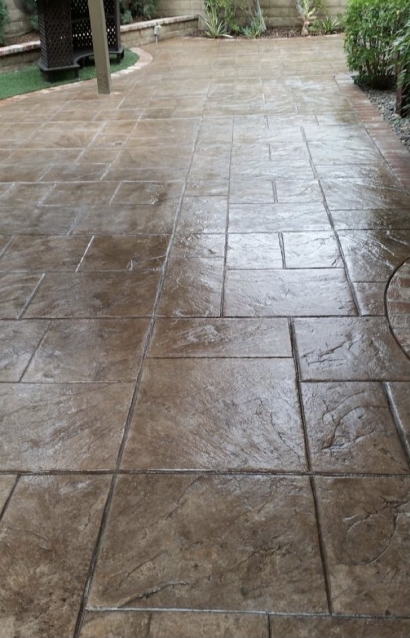 Stamped concrete patio with rich brown finish
