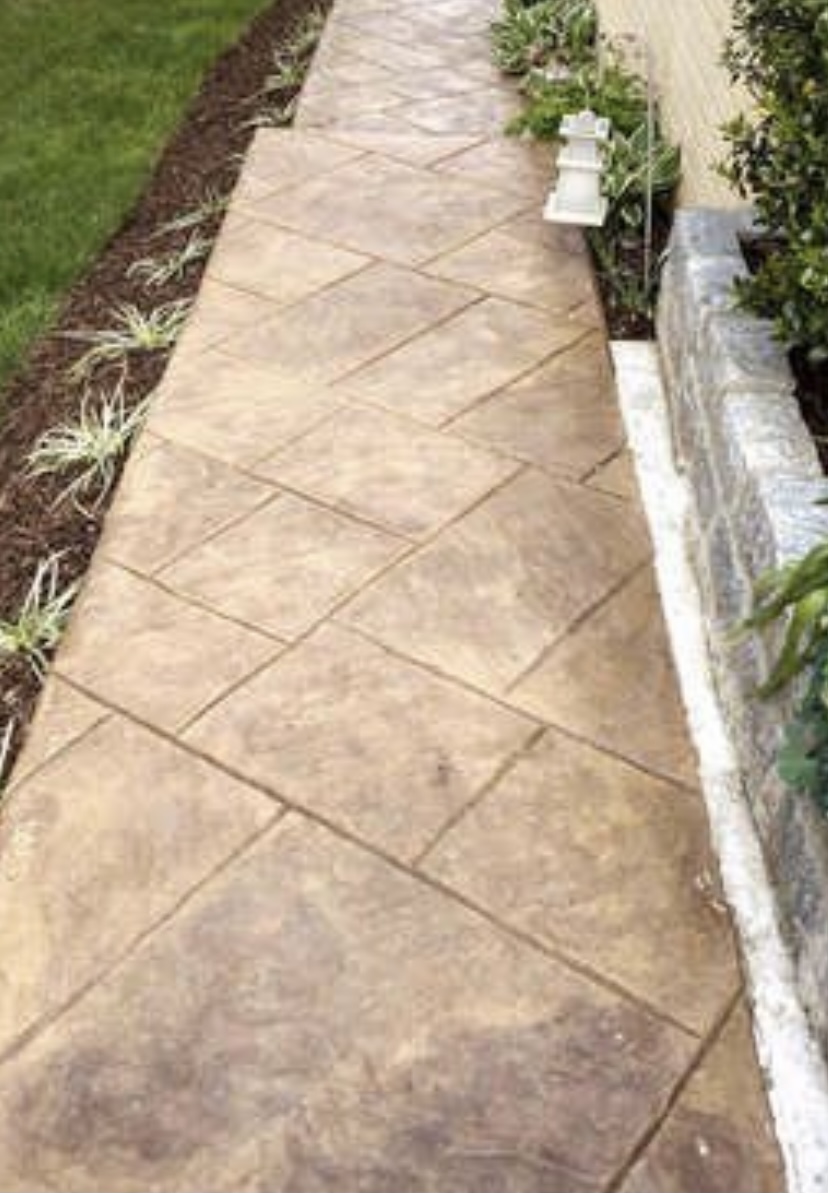 Tan stamped concrete walkway with diamond pattern